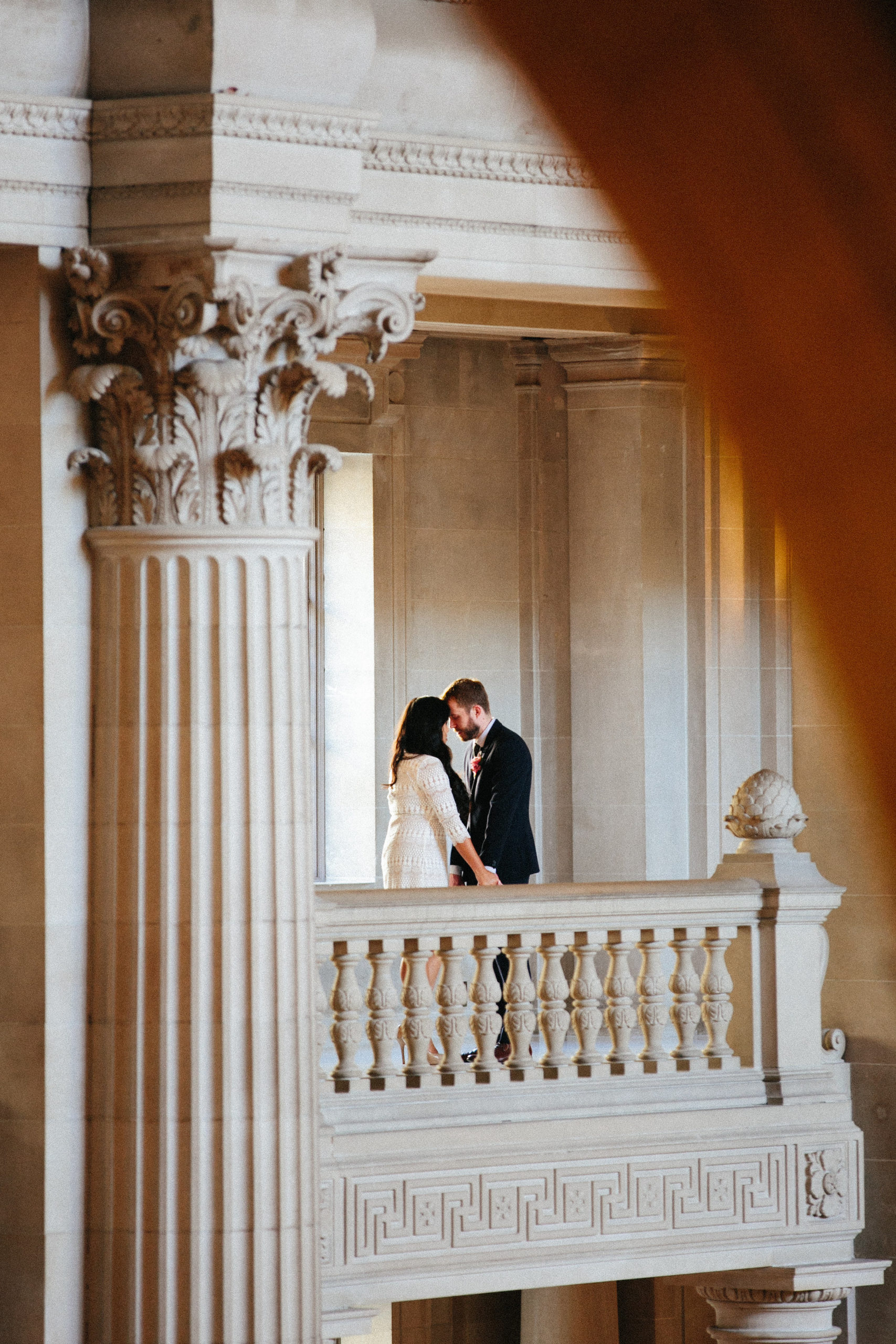Bride and Groom share an intimate moment t San Francisco City Hall